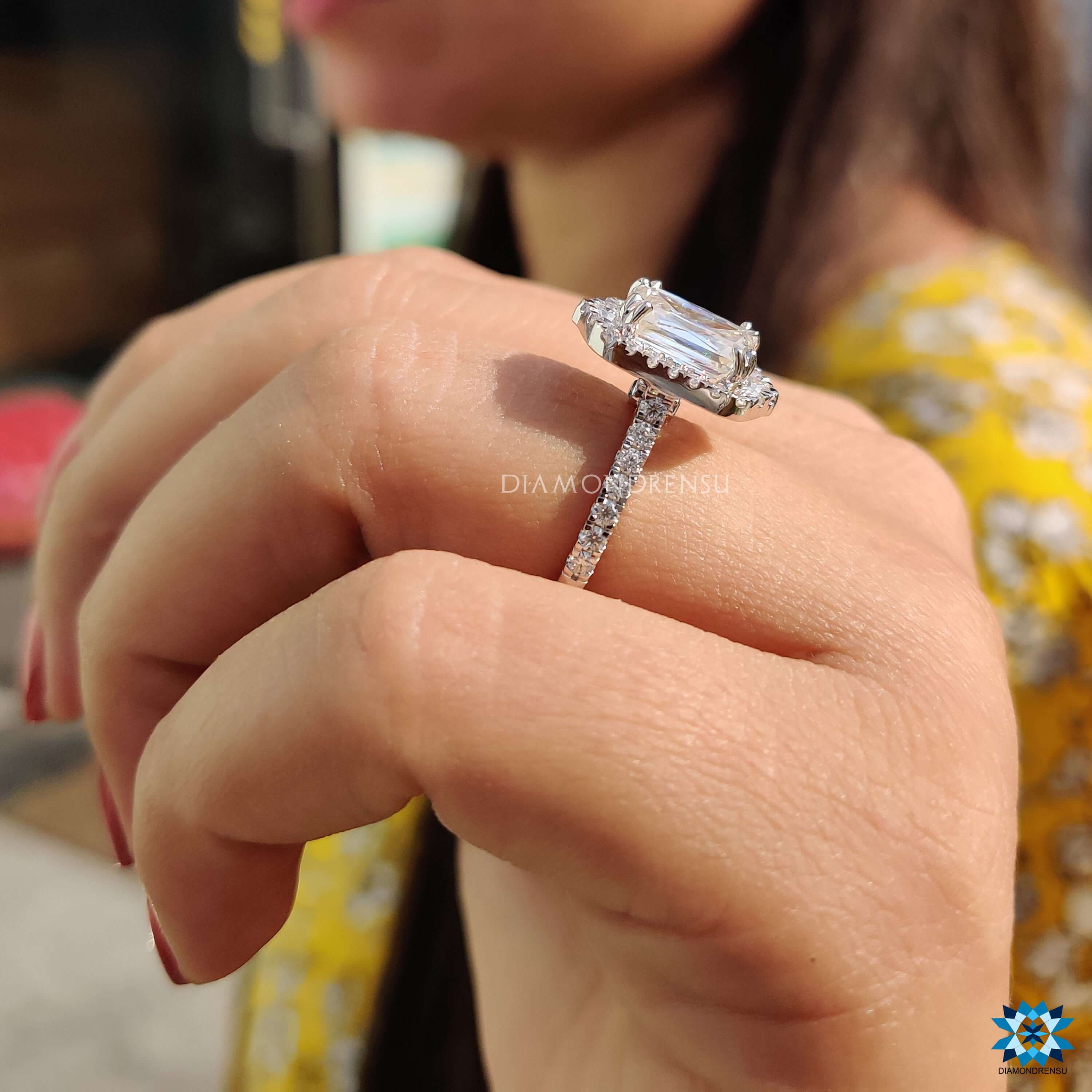 Blue moissanite halo ring in white gold with vintage accents.