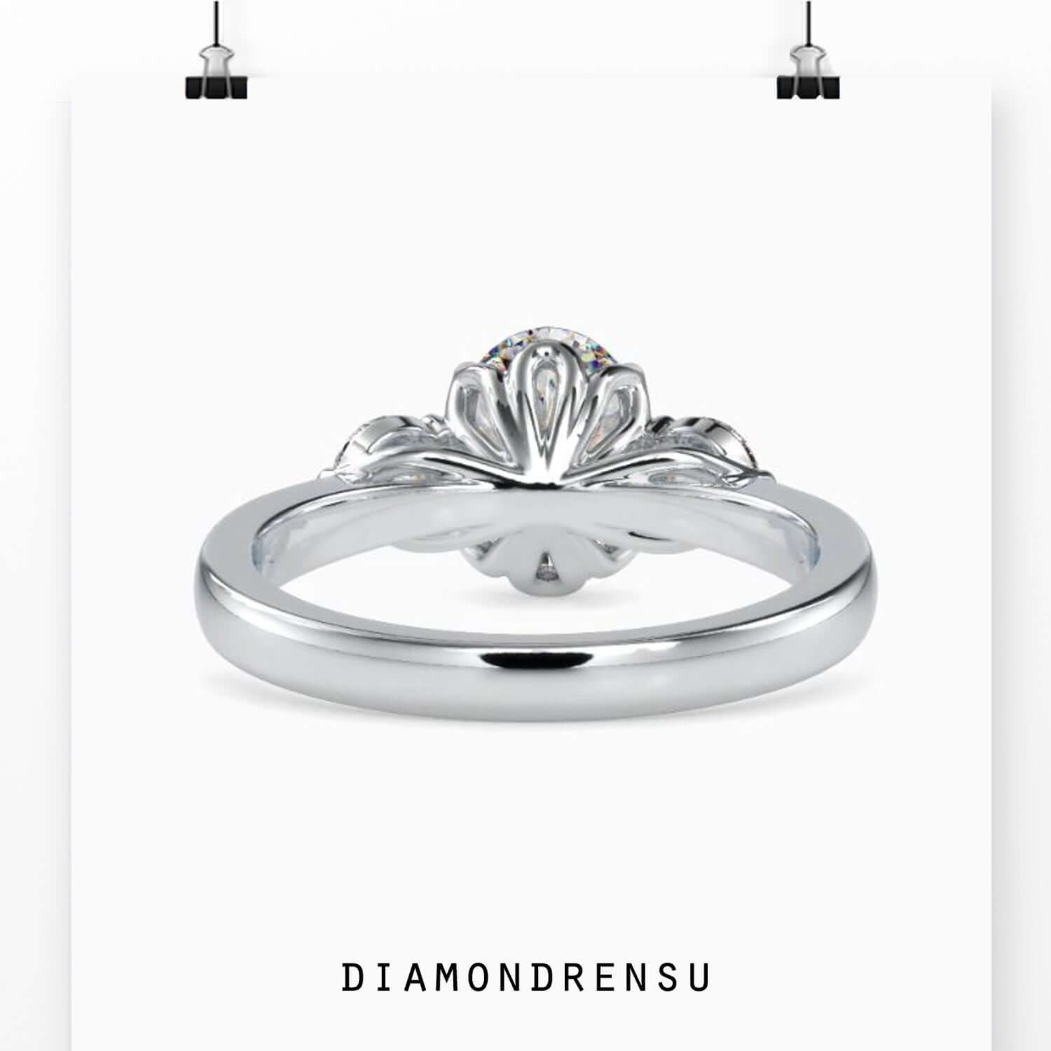IGI certified oval diamond with round side stones.