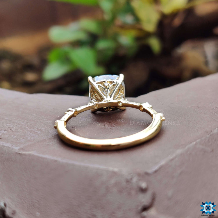 Round cut pave band ring in yellow gold.