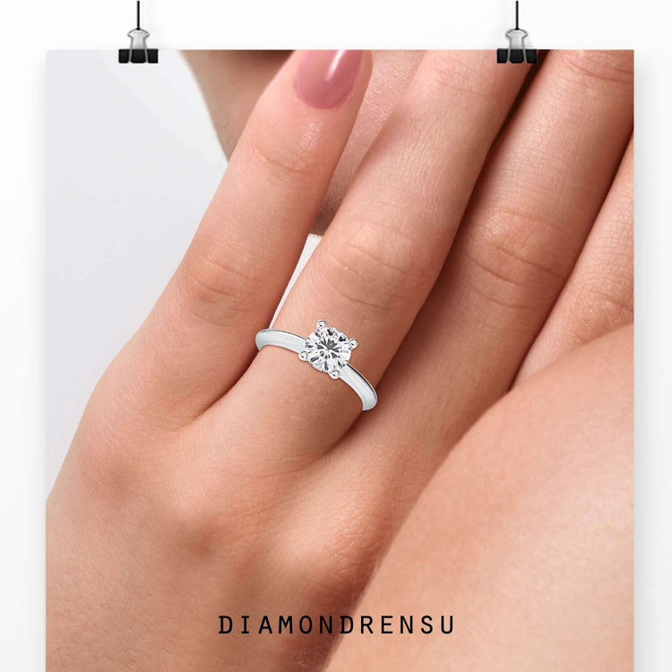 Round cut ring with handmade tapered shank band.