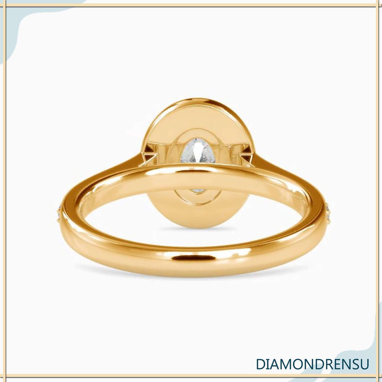 Handmade jewellery featuring oval diamond and pave accents.