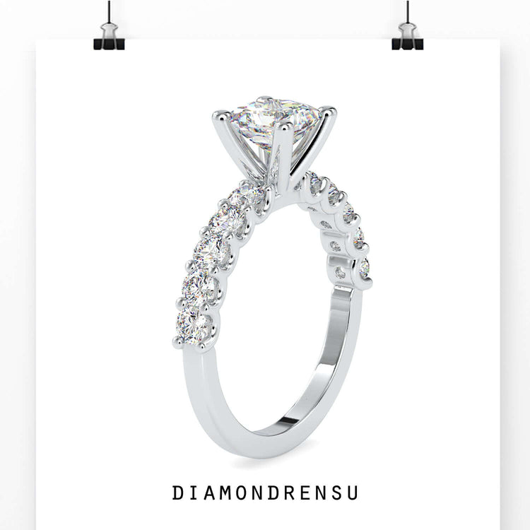 Custom design ring with princess diamond and round pave band.