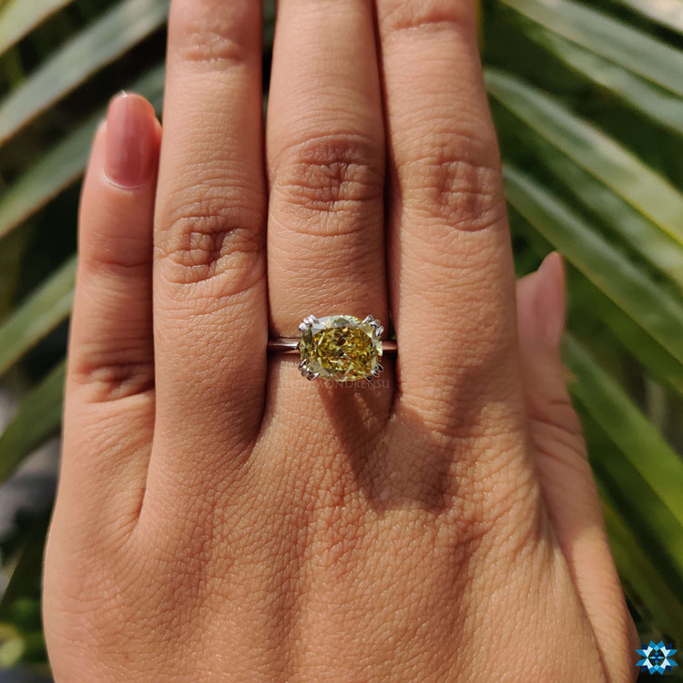 Canary yellow moissanite ring with hidden halo design.