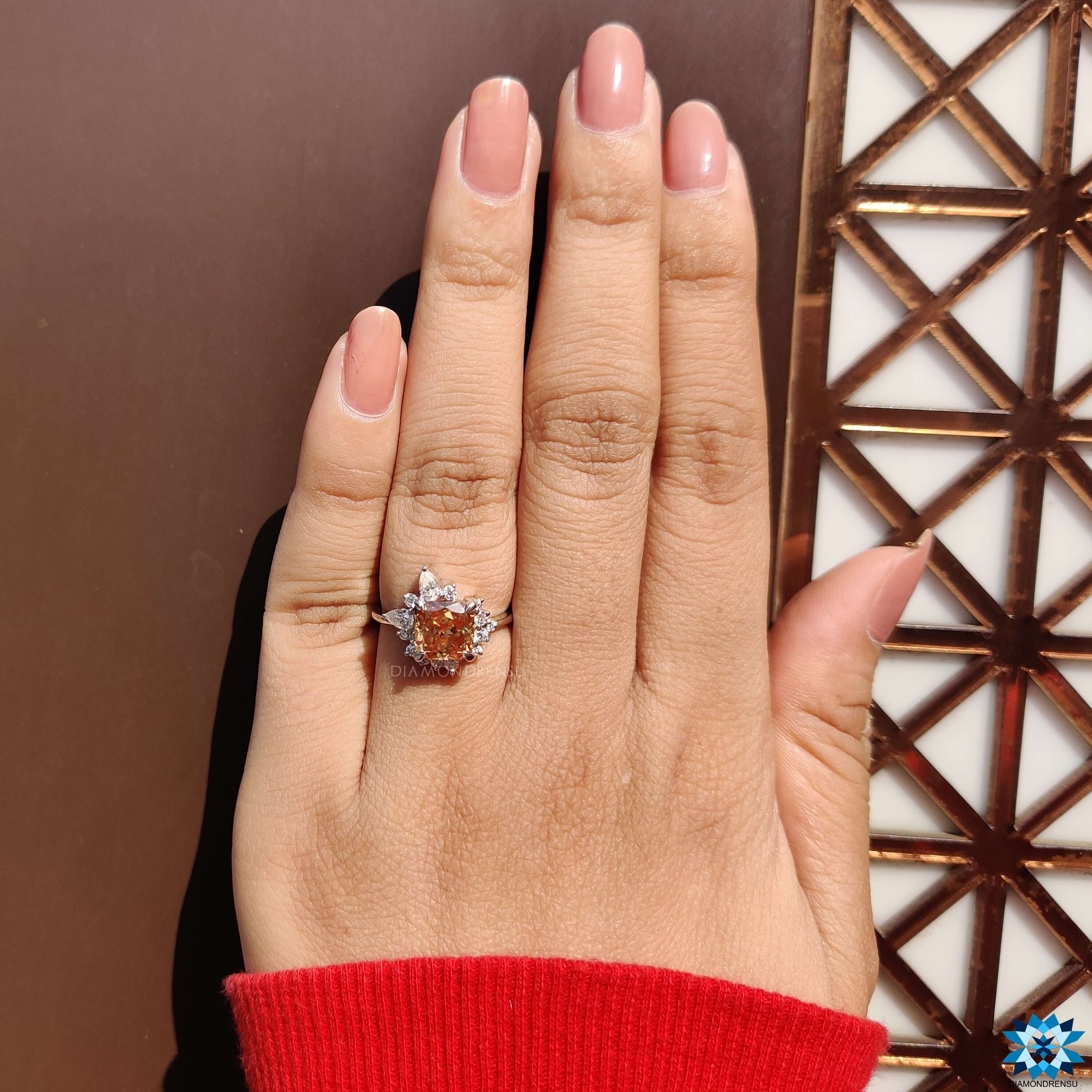 Handmade white gold ring featuring a cushion moissanite center.