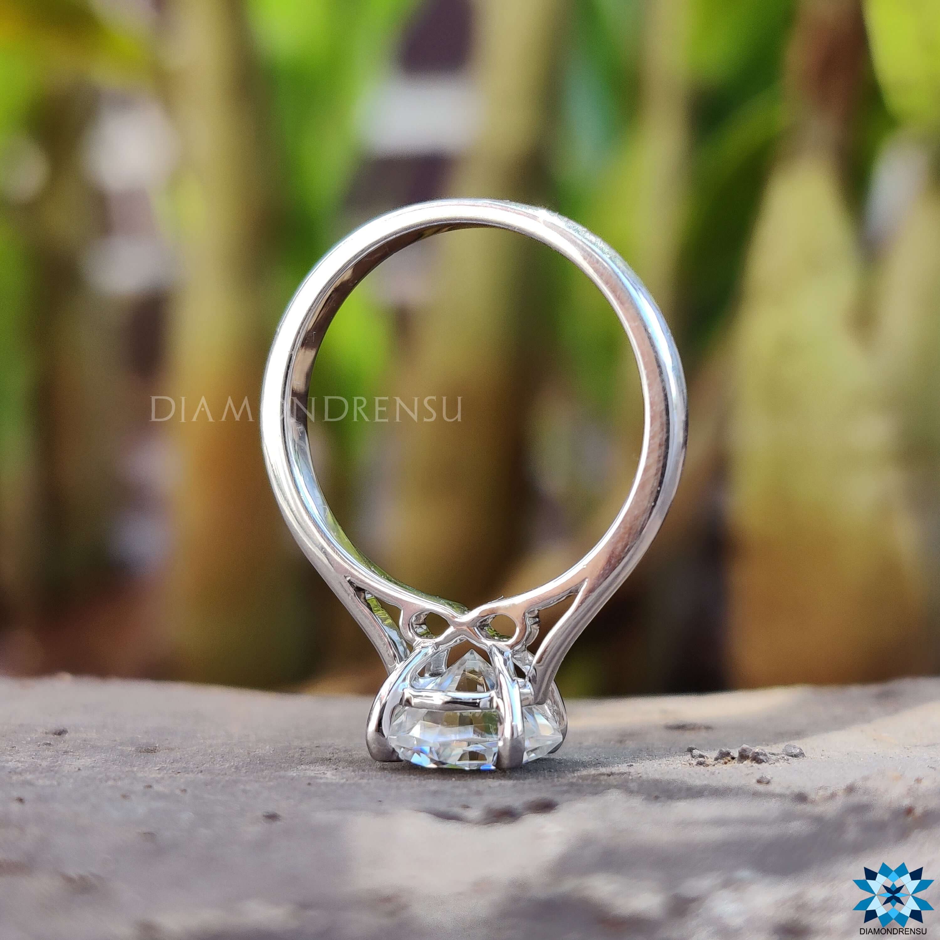 Solitaire engagement ring with hidden design and clean lines.