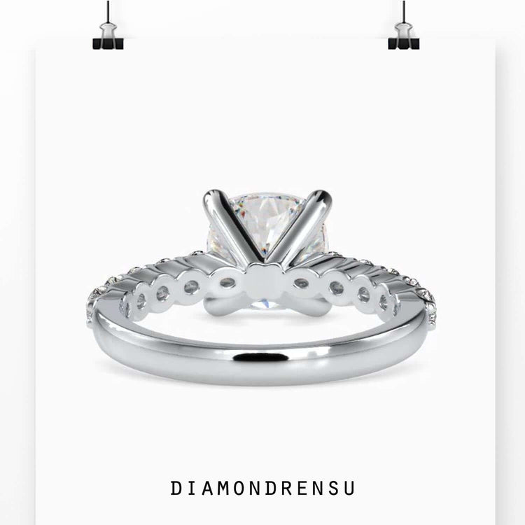Cushion cut ring with simple handmade band design.