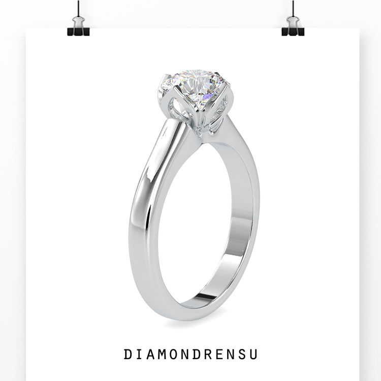 Designer ring with tulip mount and round solitaire diamond.