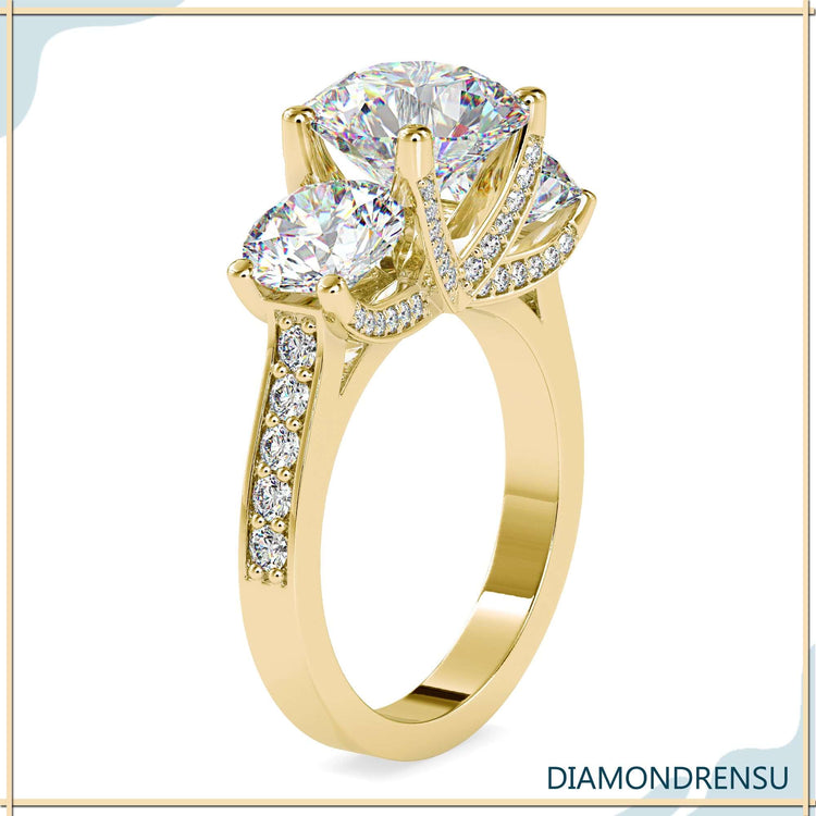 Handmade ring with 3 diamonds and round prong setting.