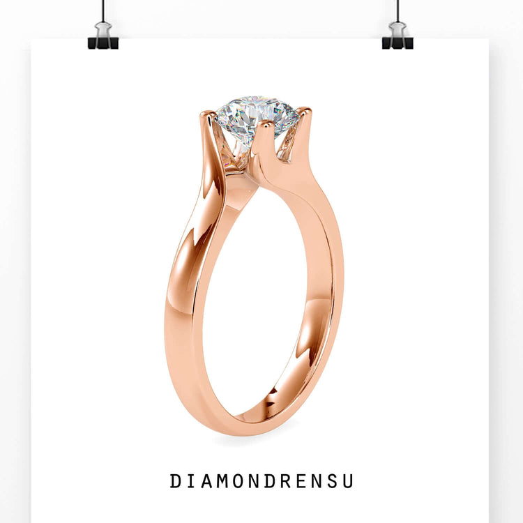 Round diamond bypass ring in yellow and white gold.