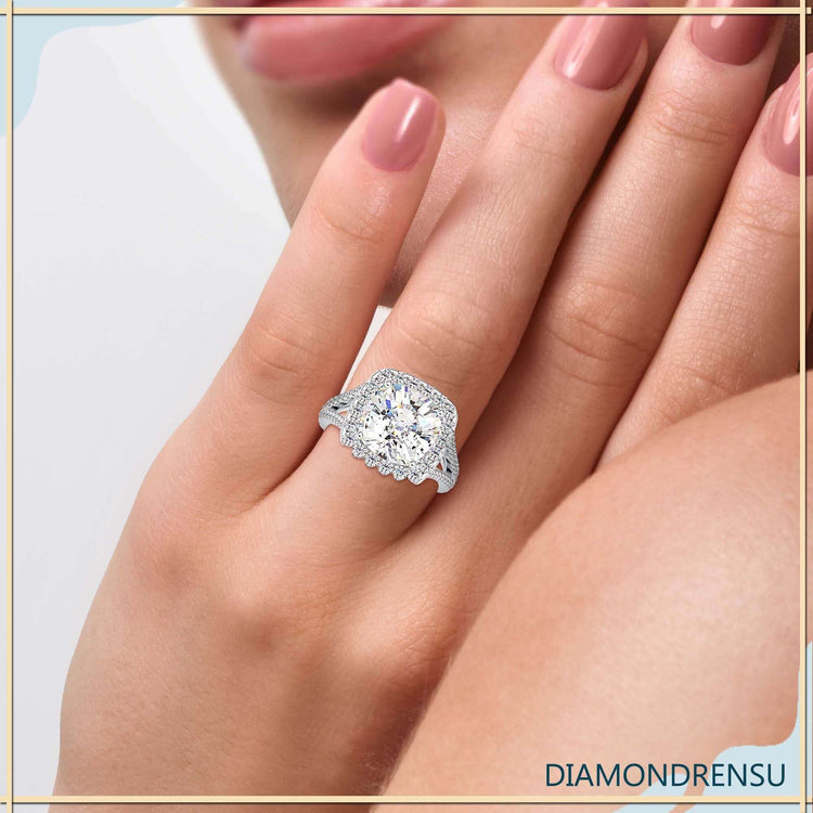 Cushion diamond centre stone in round diamond halo setting.