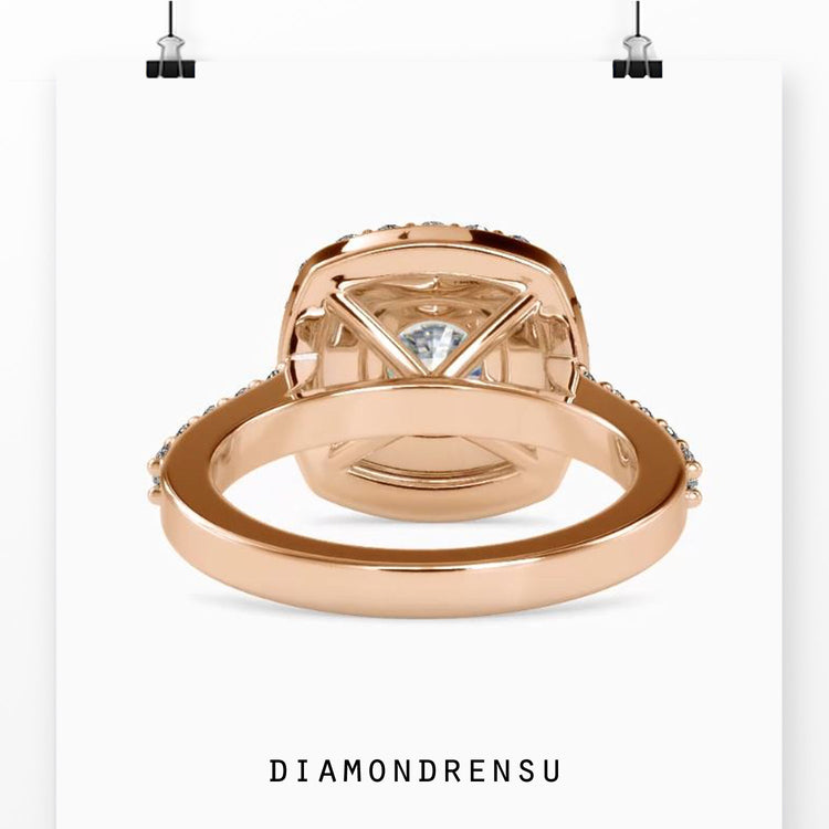 Custom engagement ring with double halo and round centre.