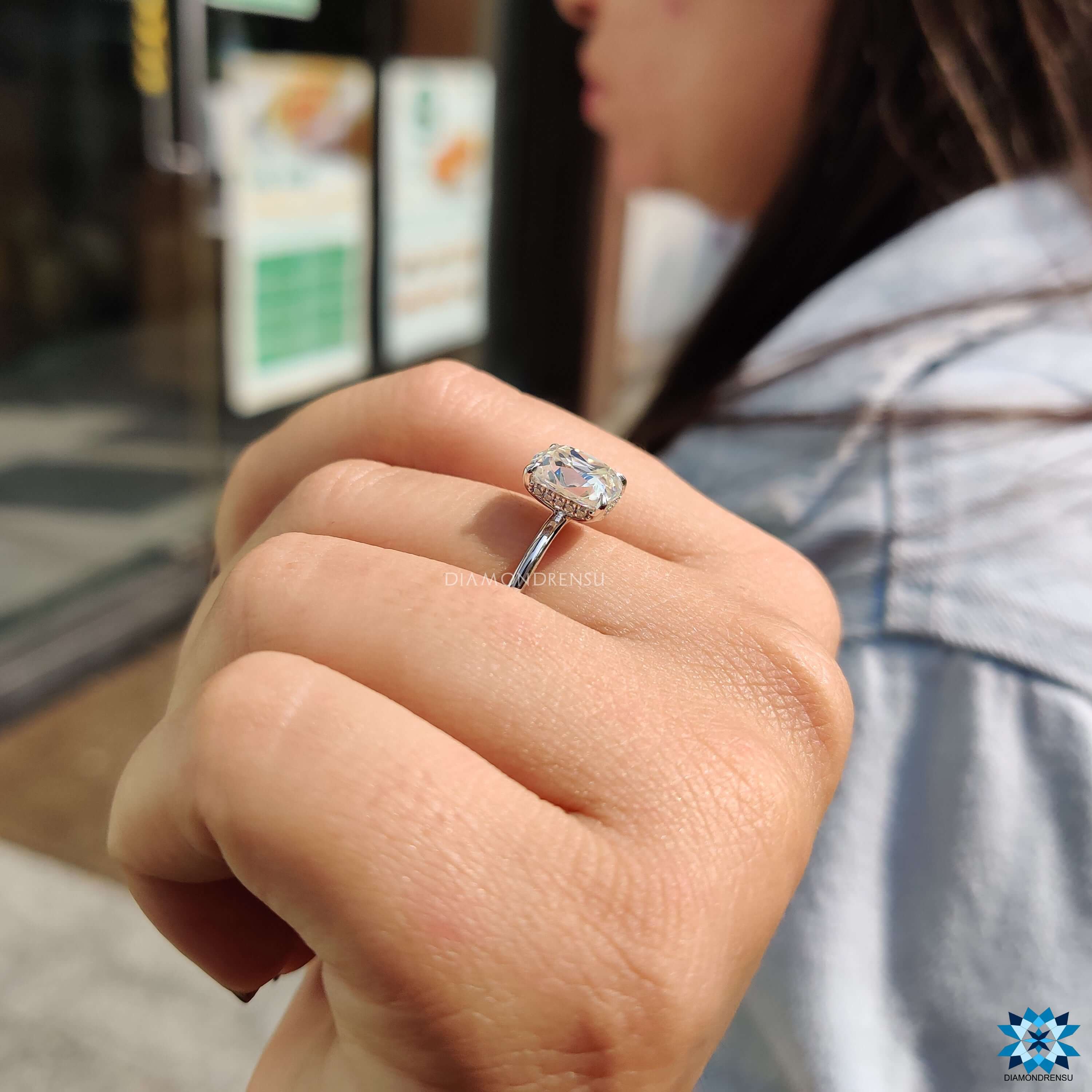 Handmade engagement ring with cushion cut moissanite.