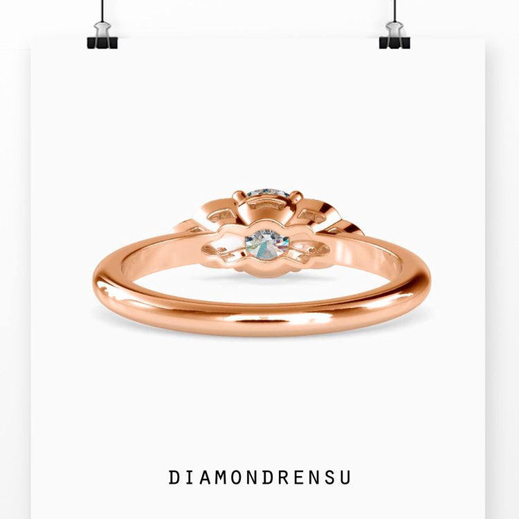 Lab diamond ring with seven round stones and four prong design.