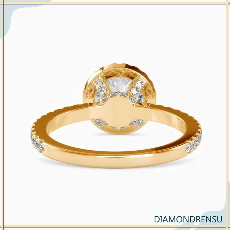 Round prong setting ring in yellow gold with custom design.