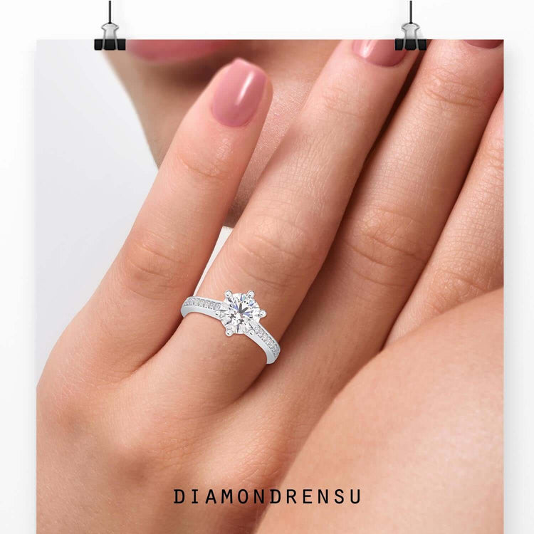 Yellow gold channel ring featuring round cut pave band.