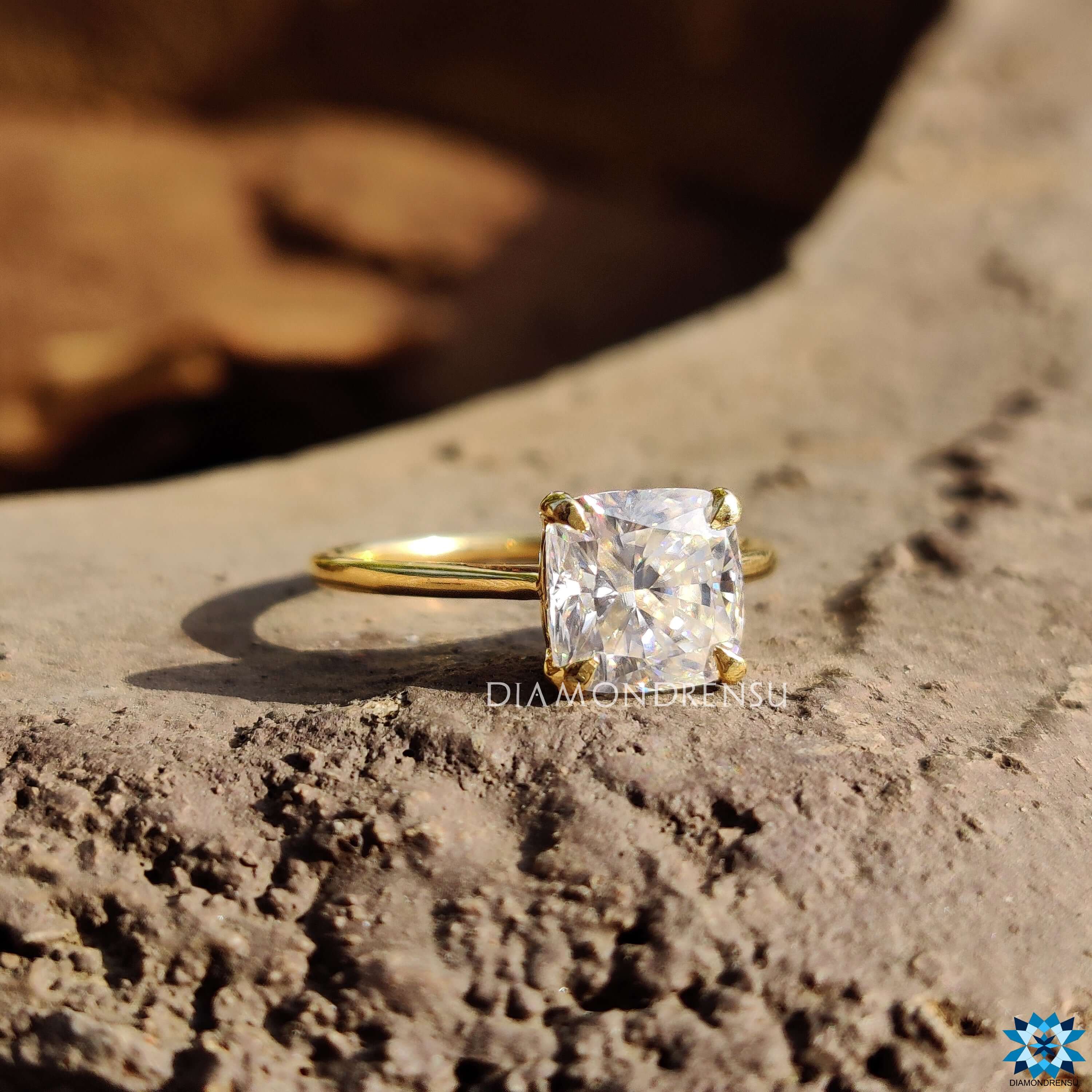 Four claw prong solitaire ring in yellow gold.