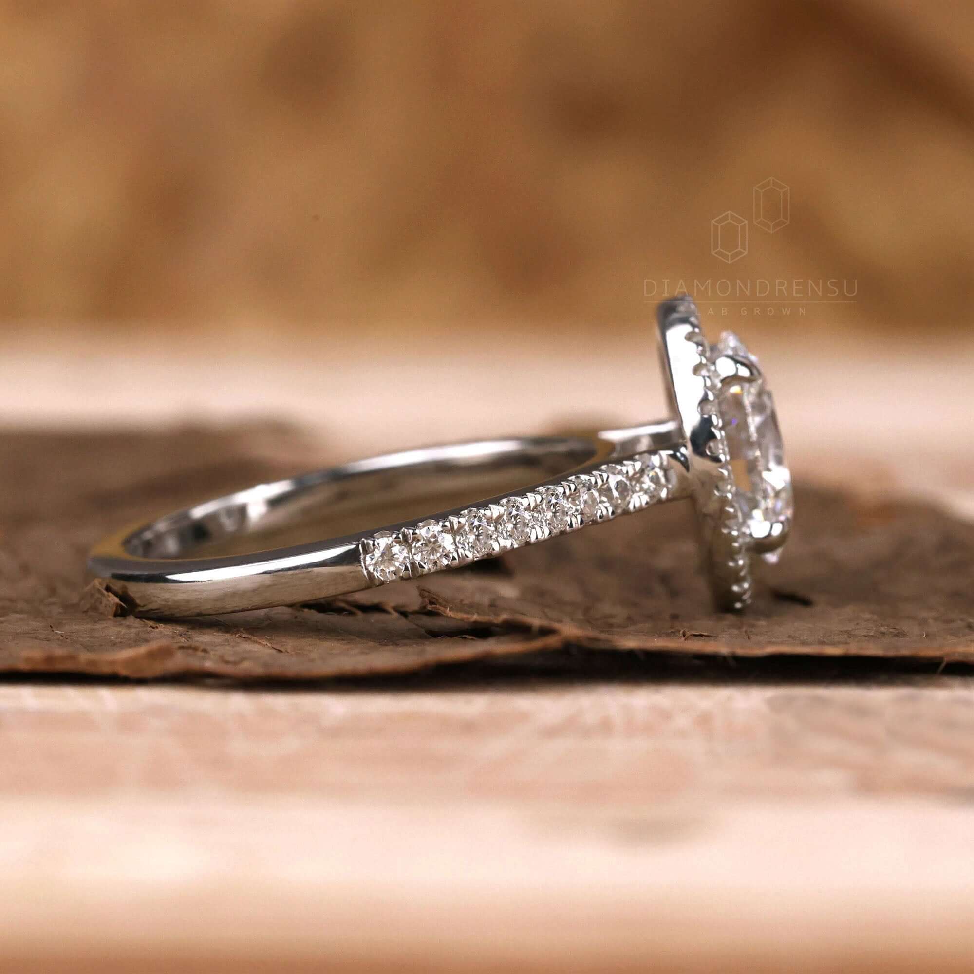 Oval engagement ring with a pave diamond band for sophisticated beauty.