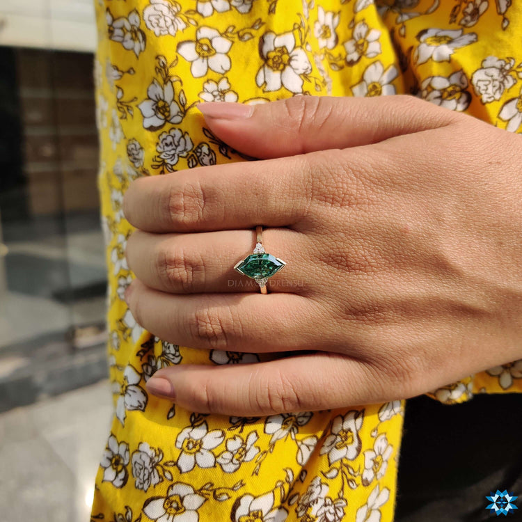 Yellow gold engagement ring featuring a Dutch marquise cut center stone.