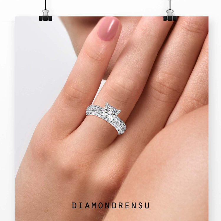 Pave setting ring with princess cut centre and side stones.