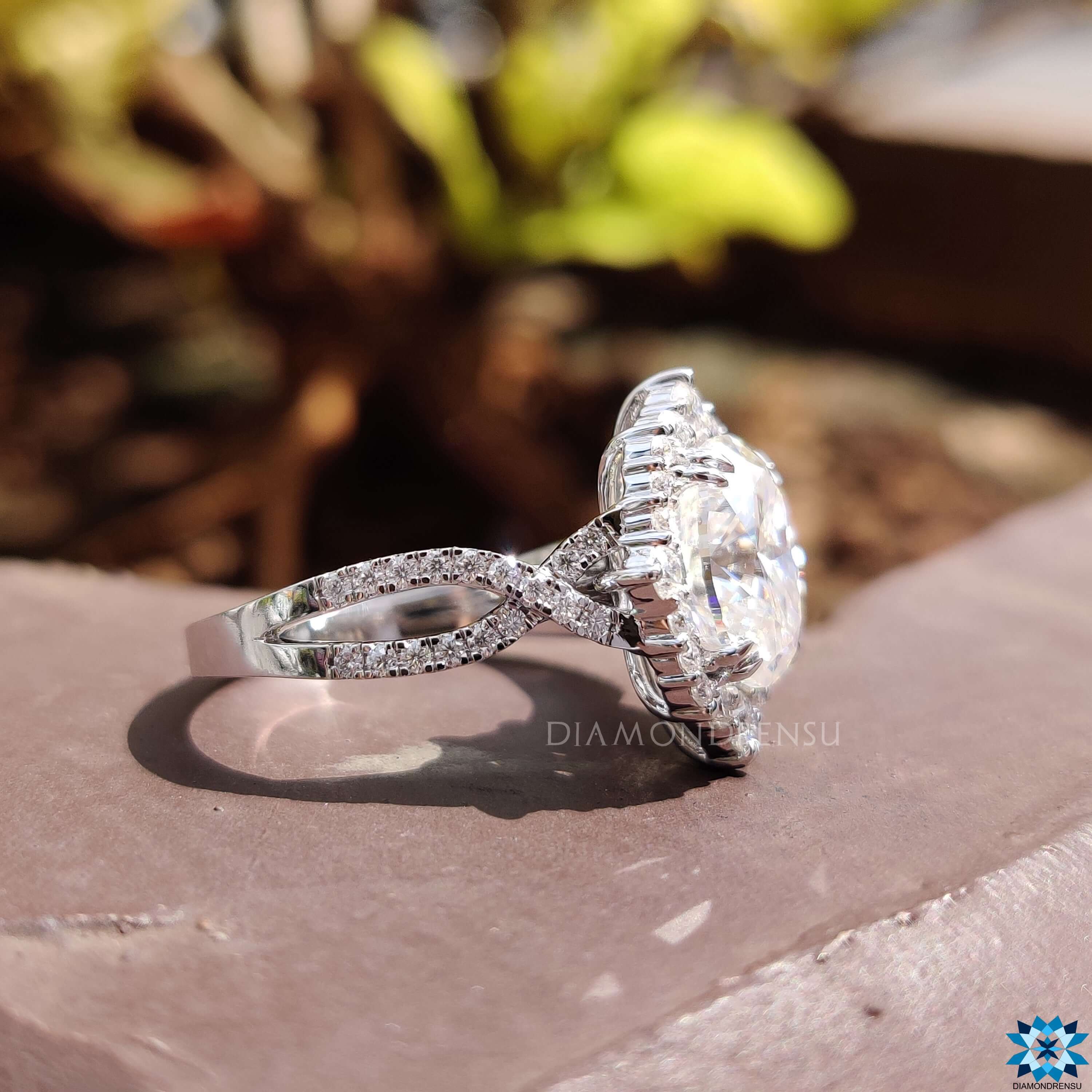 Twisted pave band with round cut pave accents.