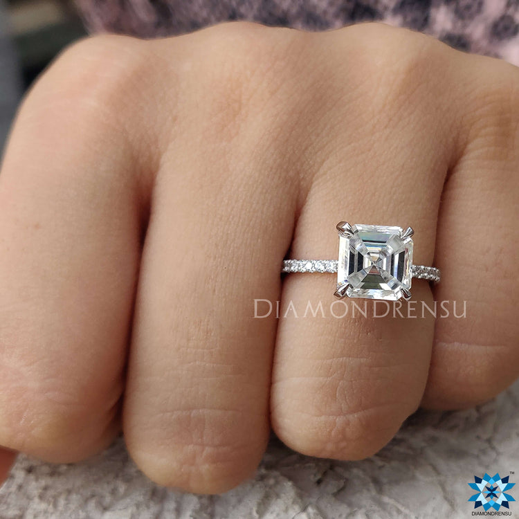 White gold ring for women featuring Asscher cut Moissanite and hidden accent design.