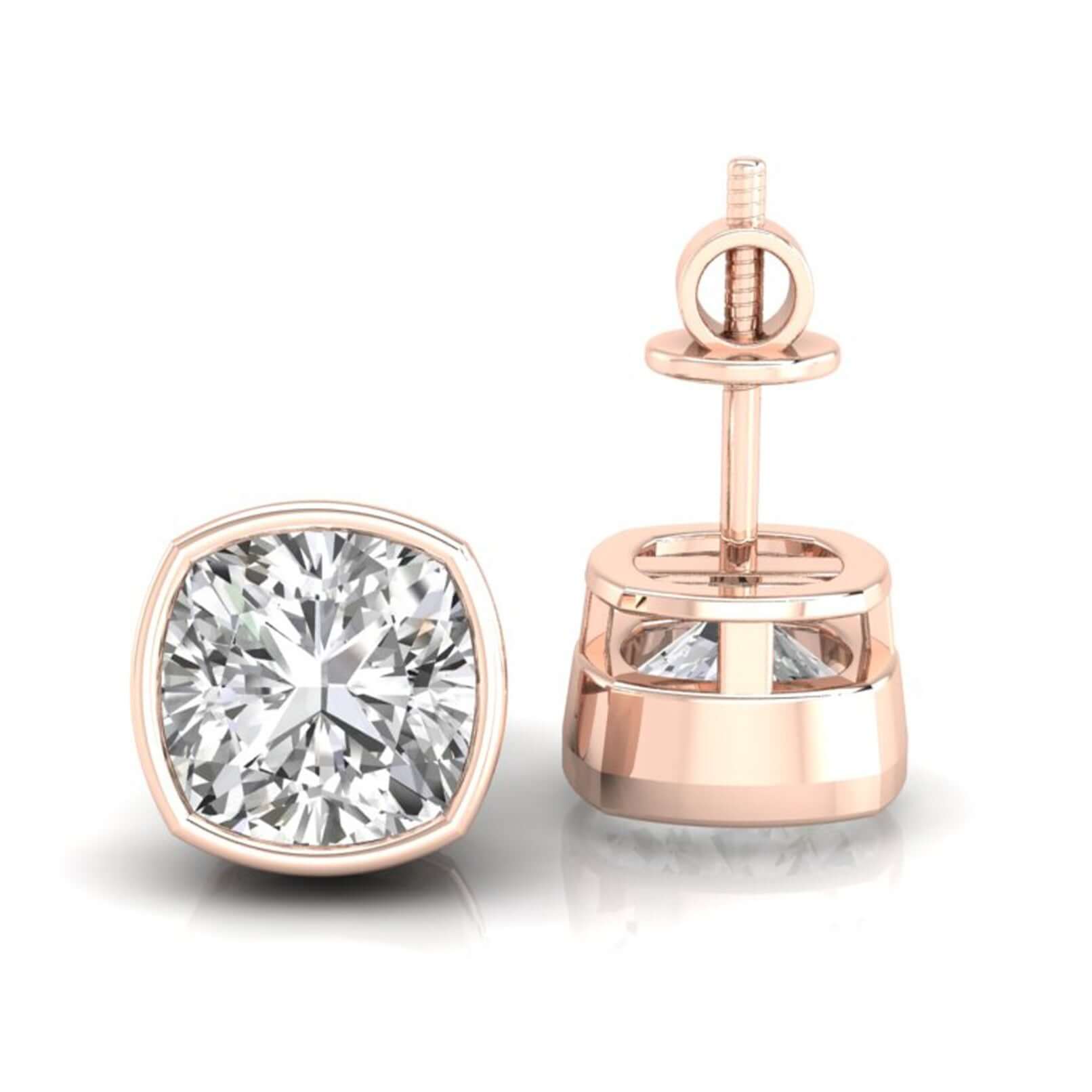Cushion cut diamond earrings with bezel setting in white gold.