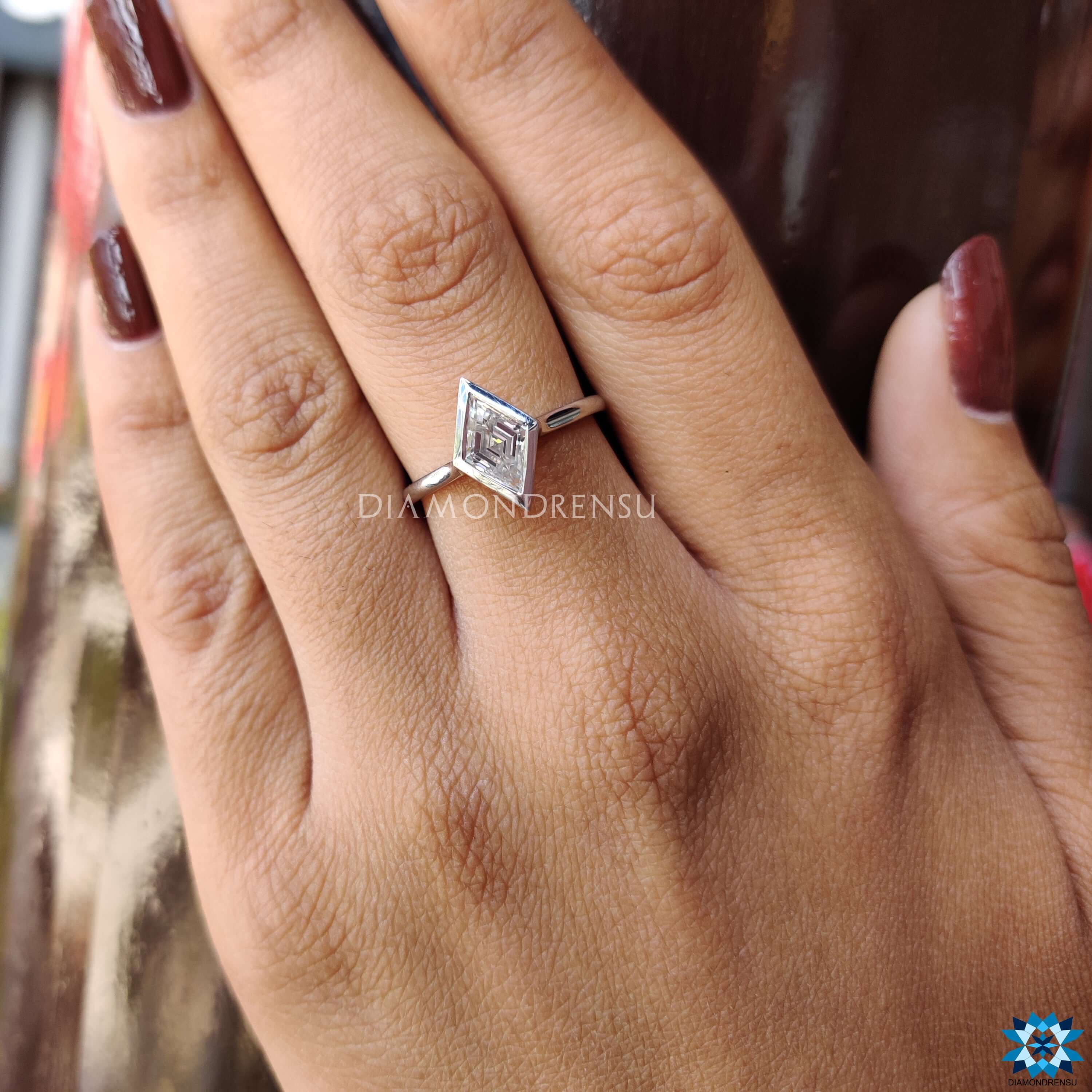 Handmade lozenge moissanite ring with prong setting.
