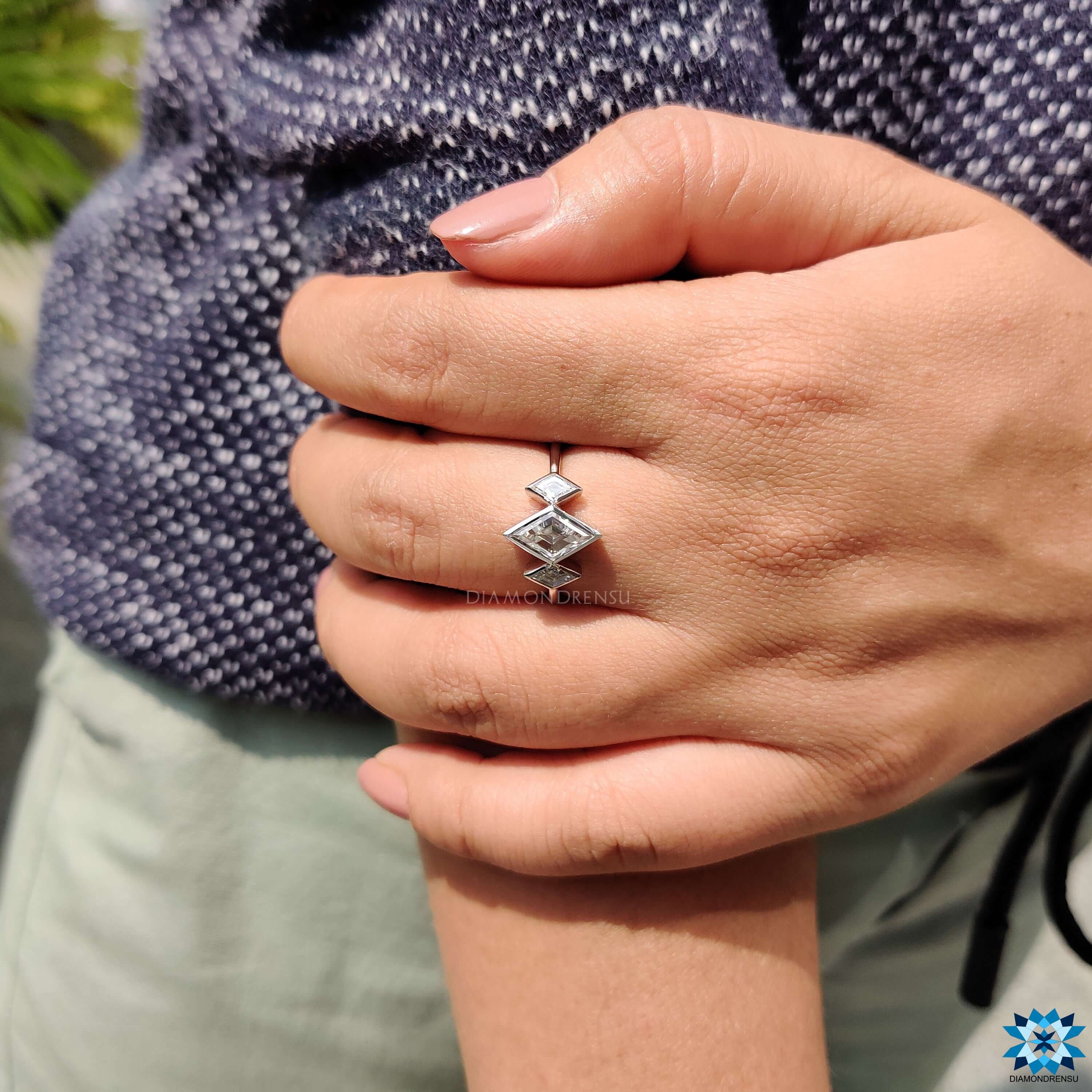 Diamondrensu UK white gold lozenge cut engagement ring.