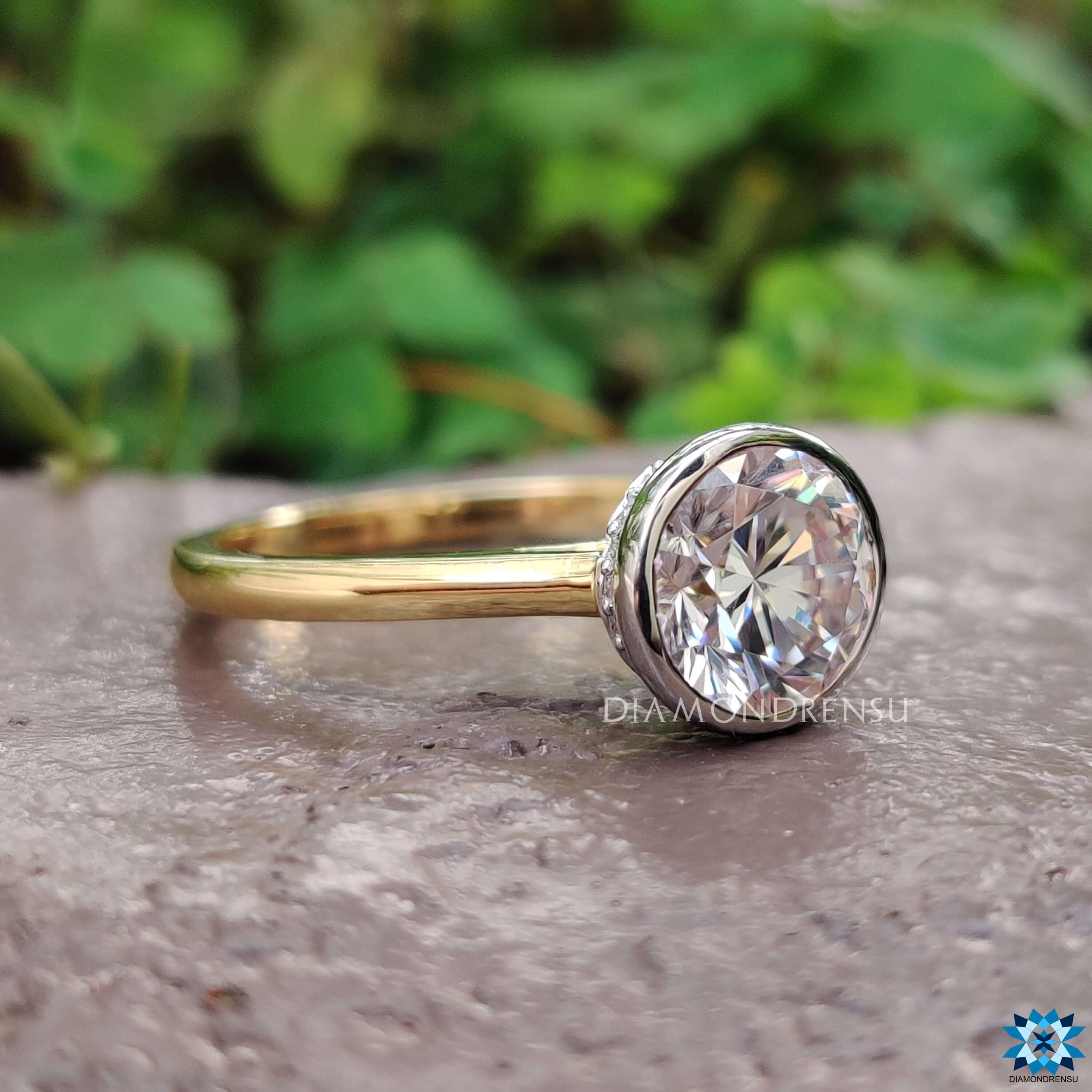 Hidden halo round moissanite ring in cathedral setting.