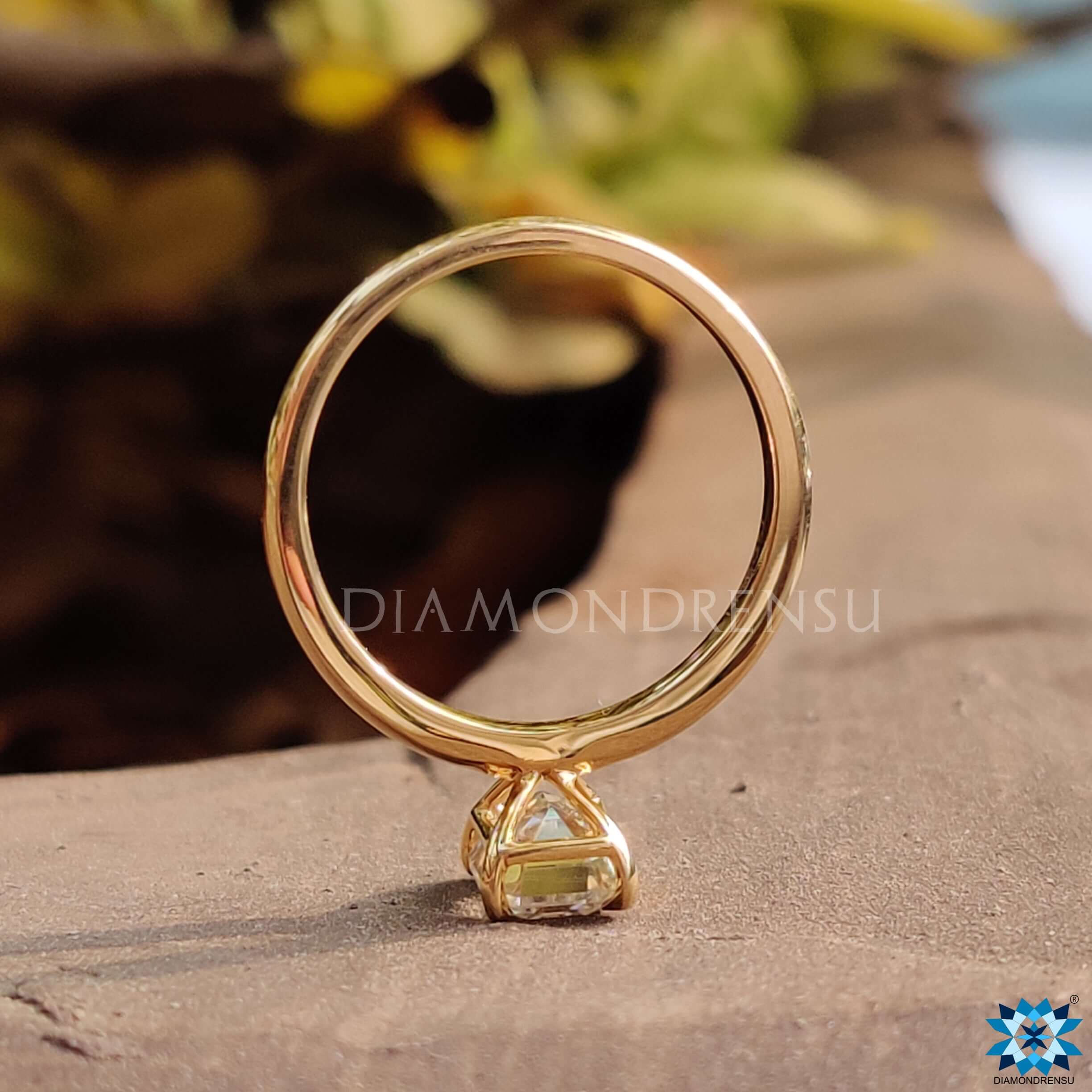 4 prong emerald cut moissanite ring.
