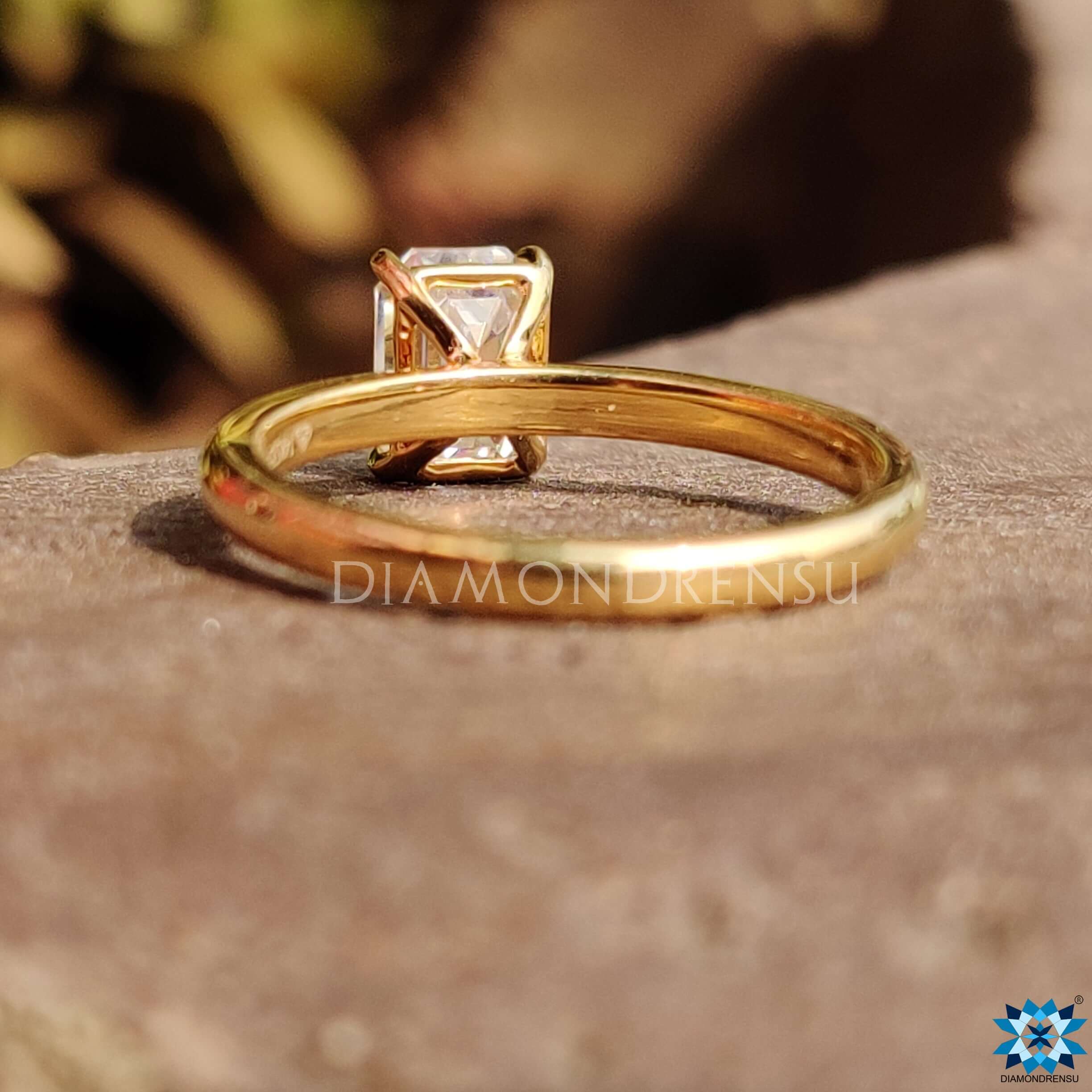 Simple moissanite solitaire ring.