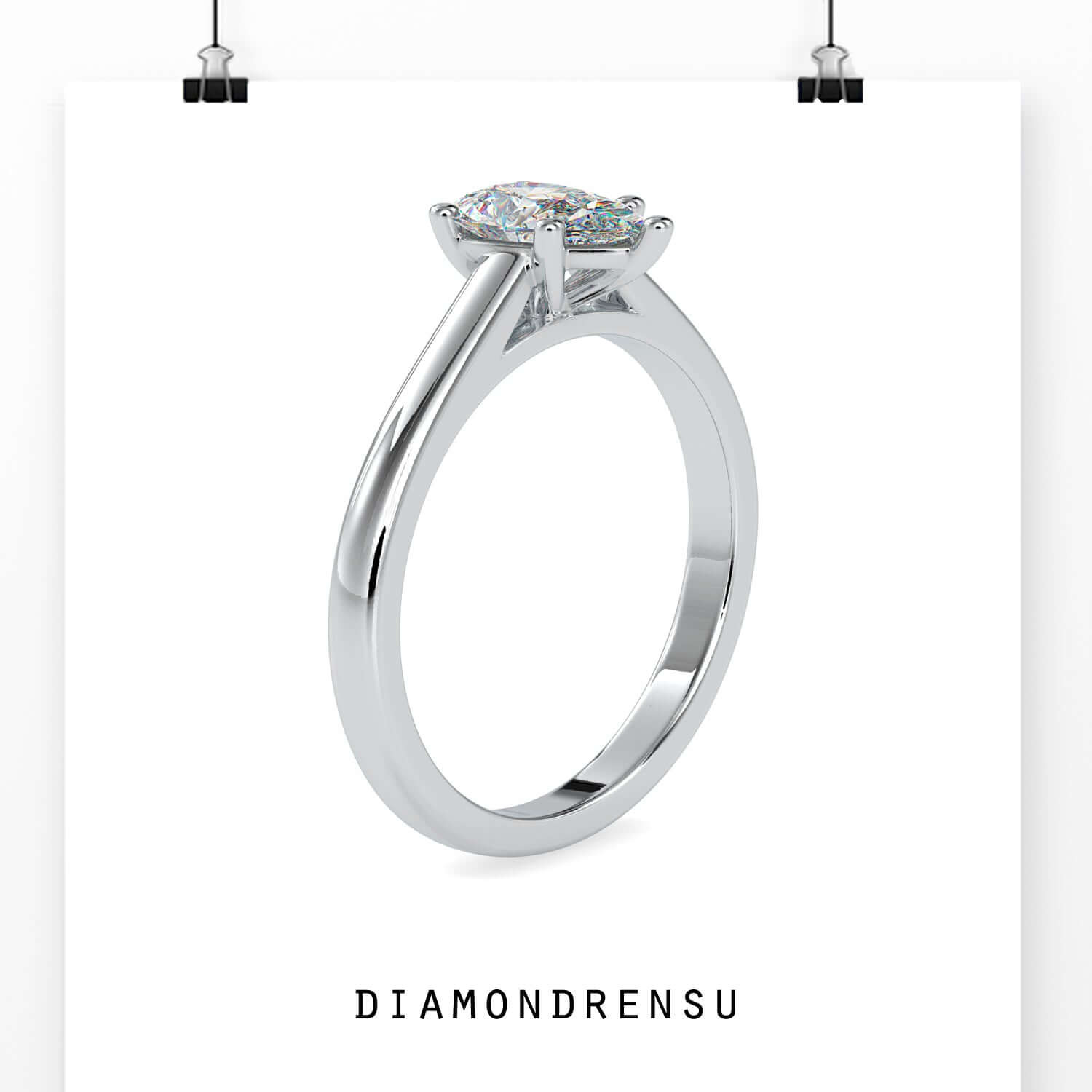 Handmade solitaire ring with cathedral and pear diamond.