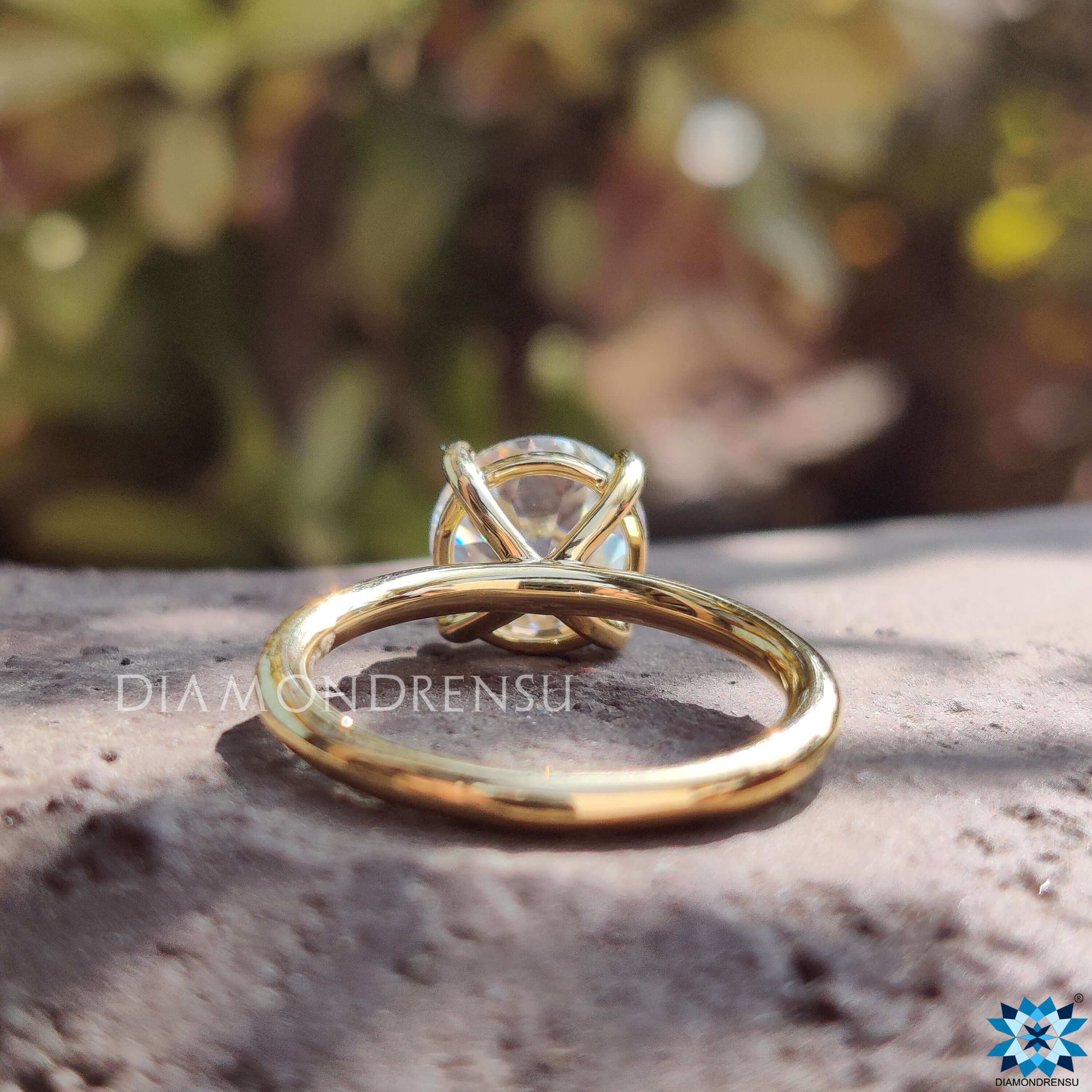 Handmade solitaire engagement ring with vintage style.
