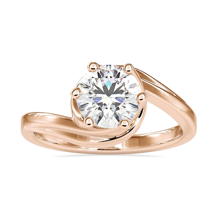 Handmade ring with round diamond and unique bypass band.