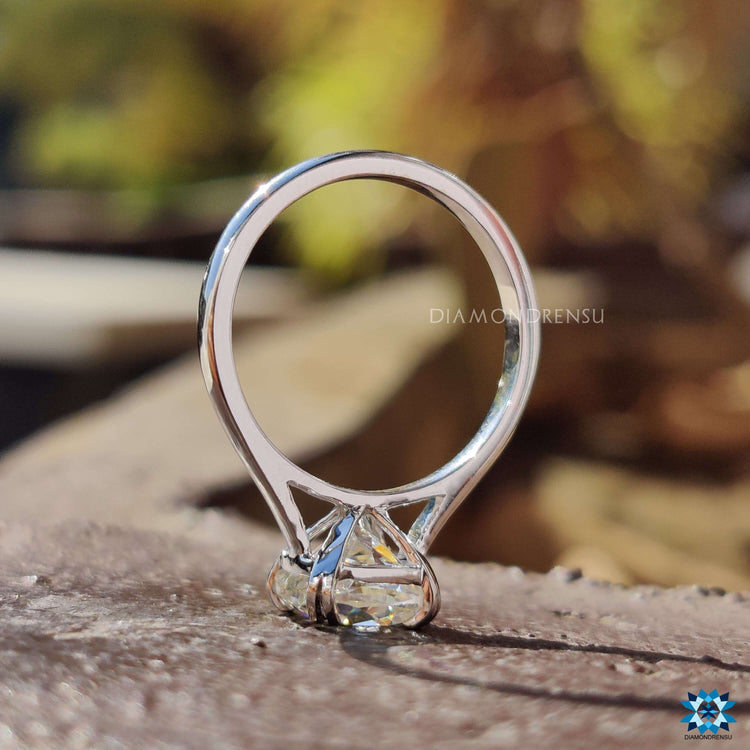 Cushion Rensu cut engagement ring with sleek prong detailing.