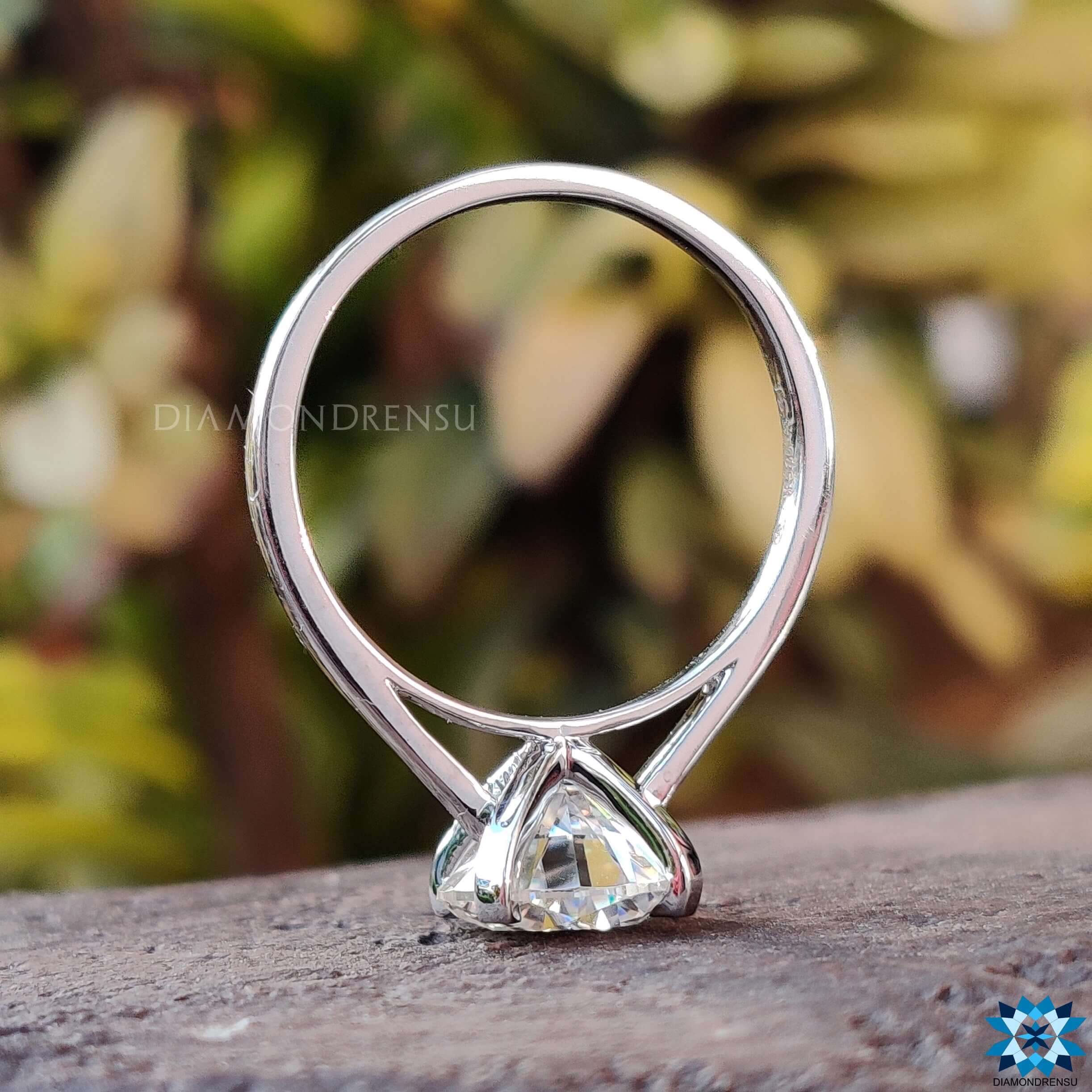 Handmade round moissanite ring.