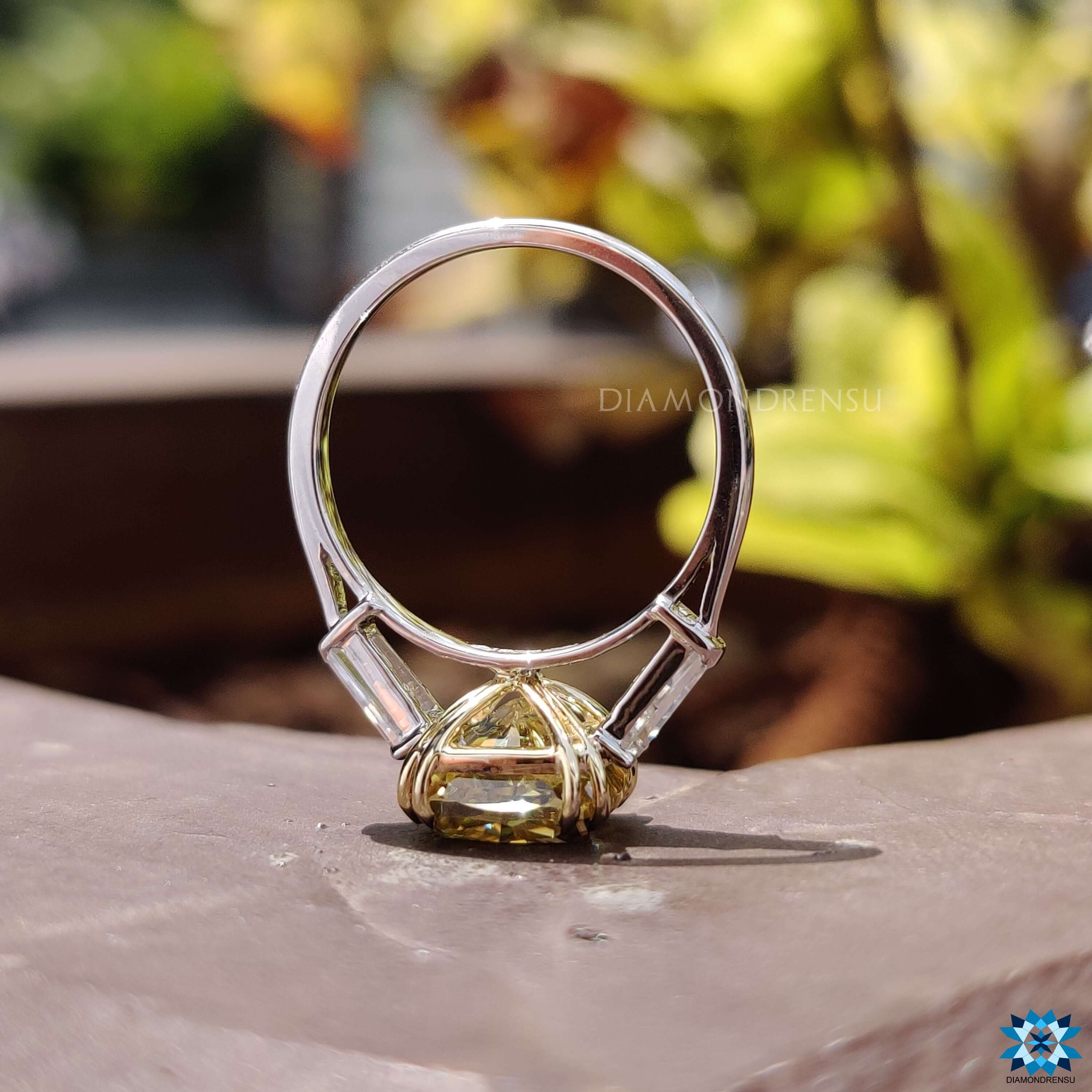 Double prong setting on cushion cut moissanite ring.