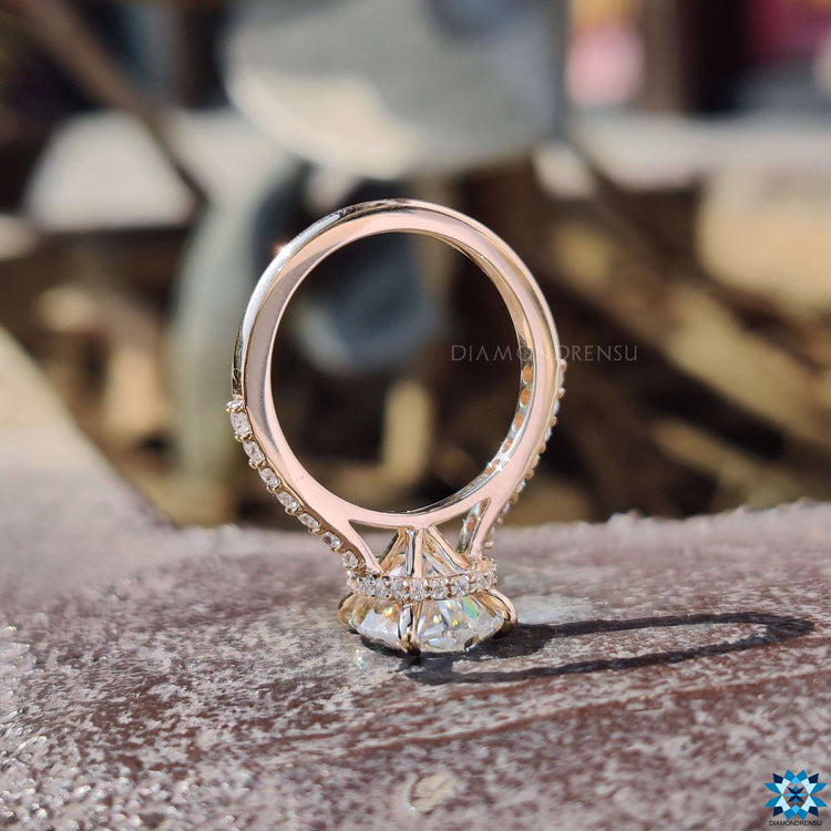 Custom engagement ring featuring oval moissanite.