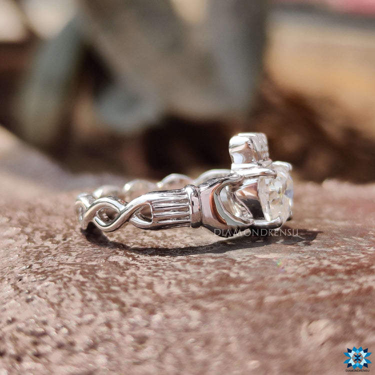 White gold moissanite ring with 4 prong setting.