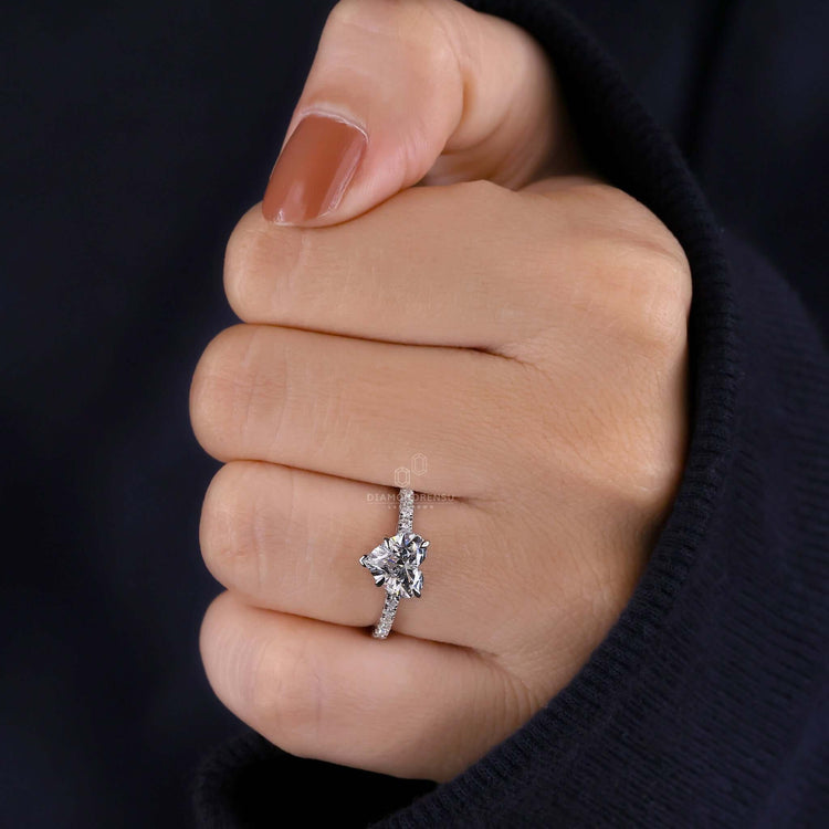Pave diamond ring with heart shaped engagement ring design and a claw prong setting for secure brilliance.