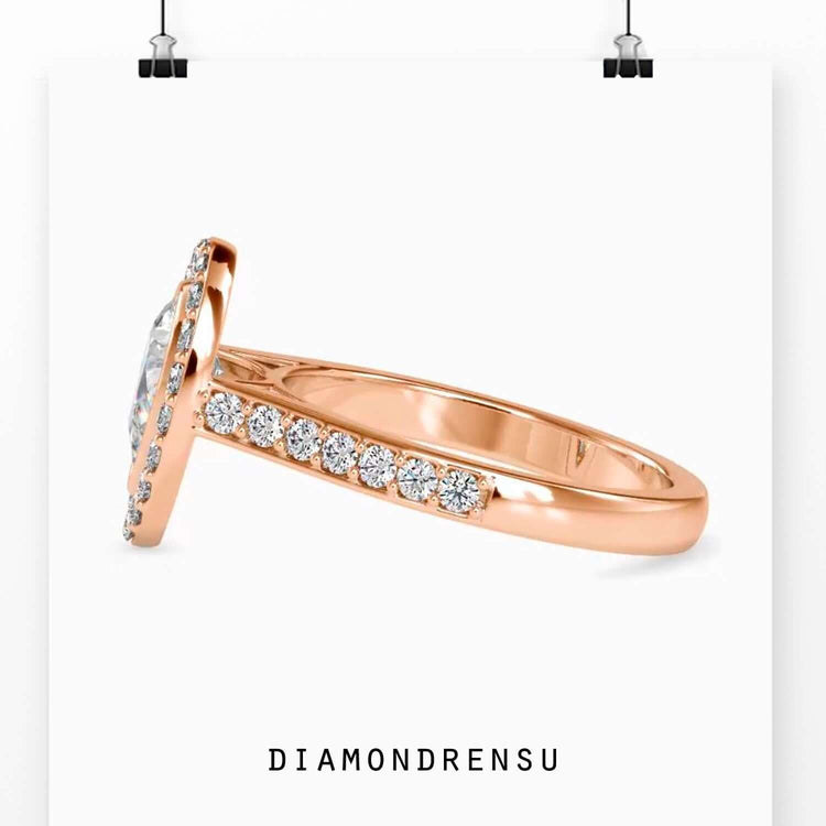 Custom design ring with pear cut diamond and halo setting.