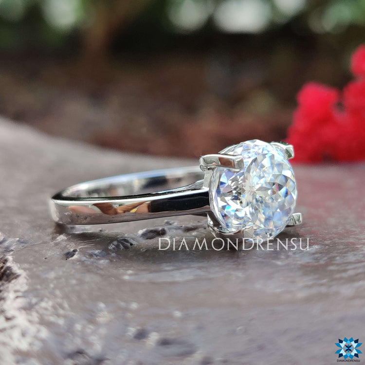 Moissanite engagement ring in white gold finish.
