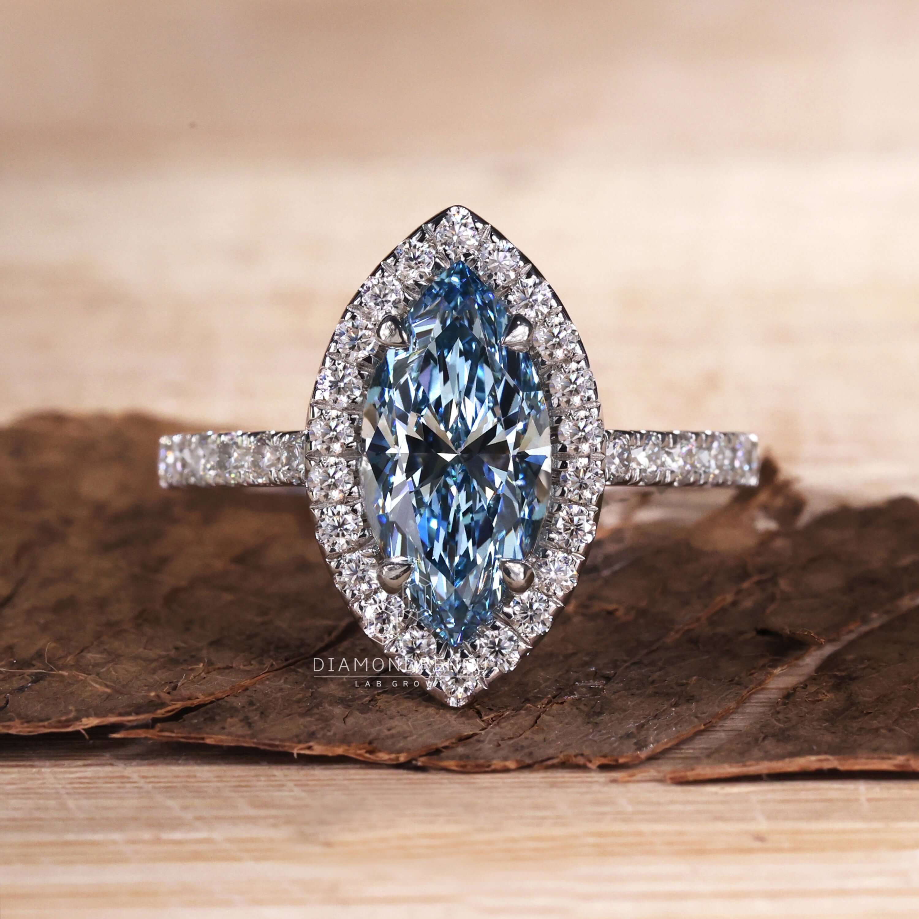 Marquise halo engagement ring paired with a brilliant halo ring setting.