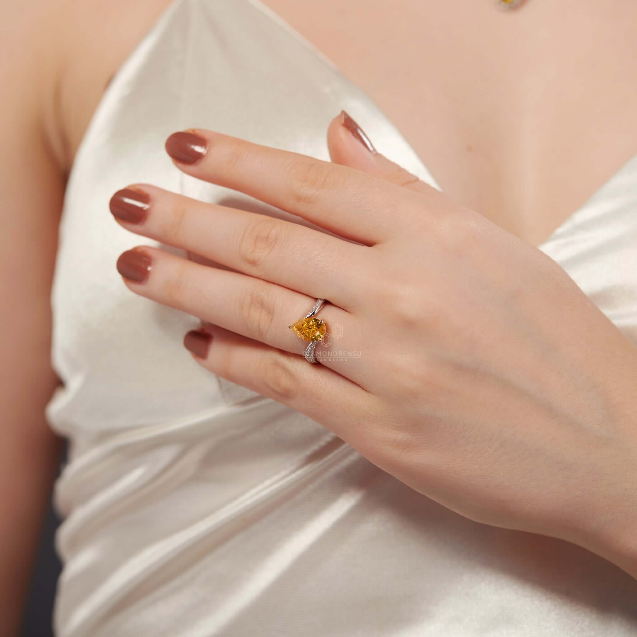 Bypass ring engagement ring with a classic pear diamond ring