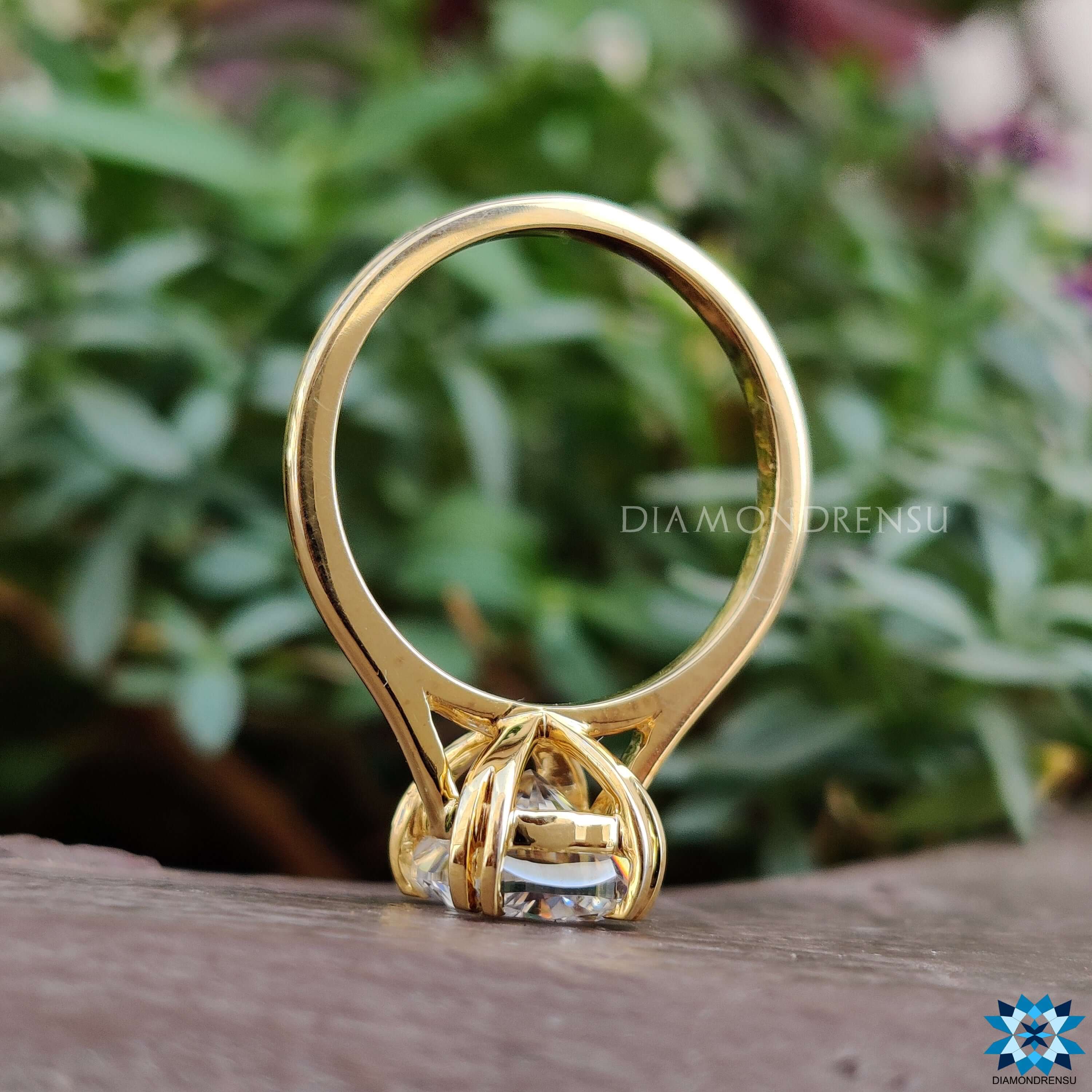Double tab prong solitaire ring.