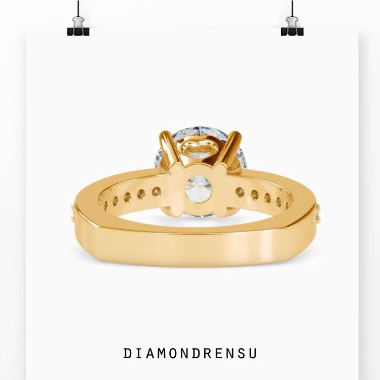 Yellow gold engagement ring with a classic round cut diamond.