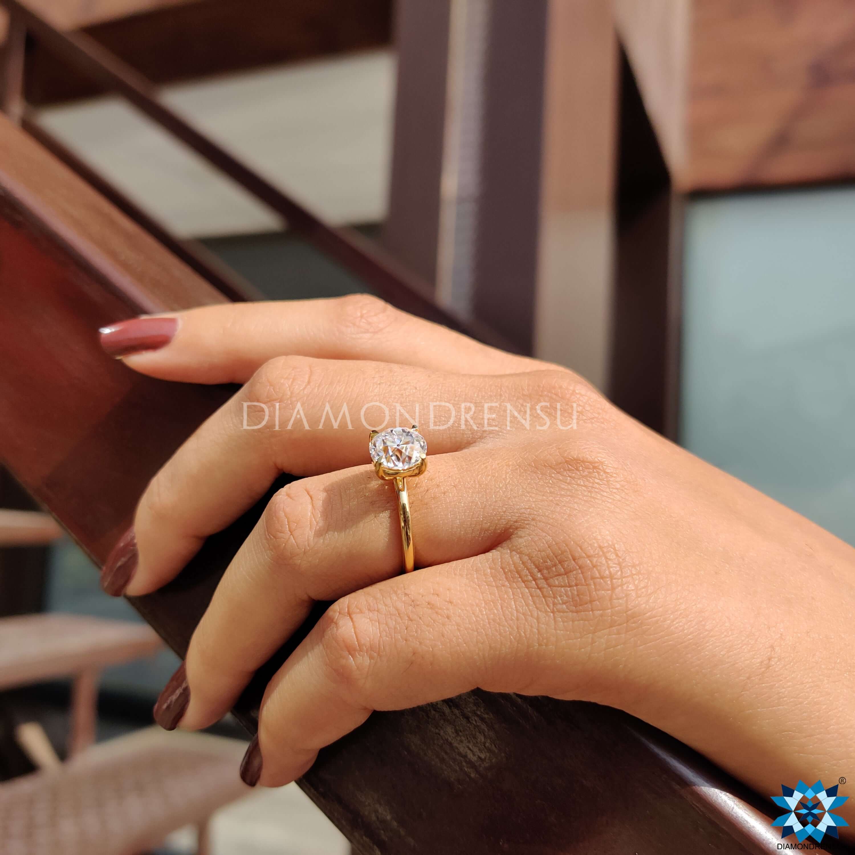 Elegant yellow gold ring with prong set round center.