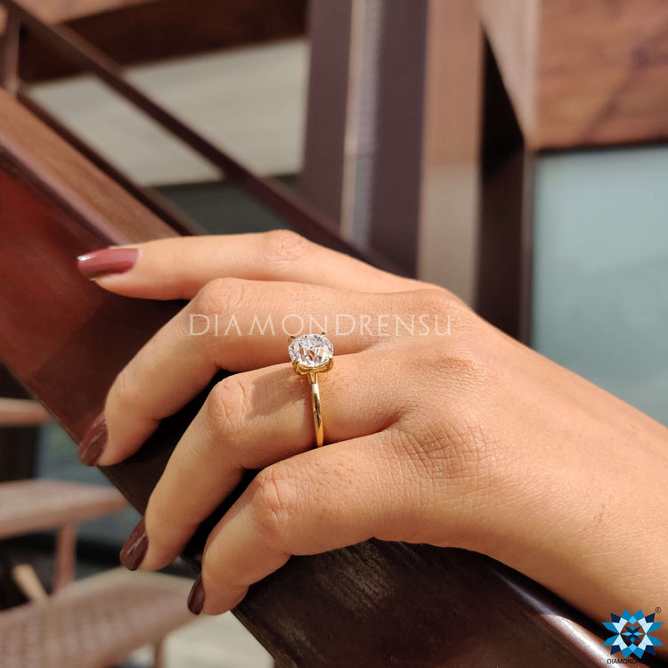 Elegant yellow gold ring with prong set round center.