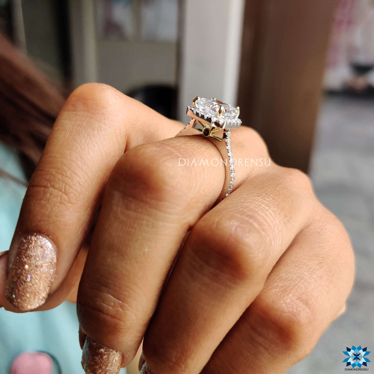 Moissanite engagement ring with gray center and peekaboo detail.