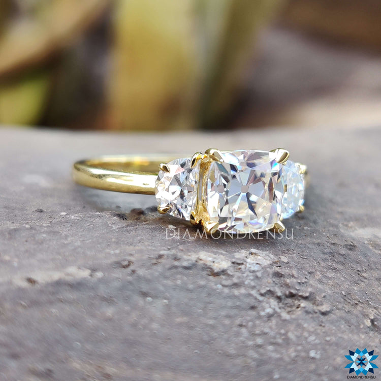 Handmade moissanite ring with cushion and half moon stones.